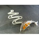 Silver Dolphin Pendant approx 14.5mm x 38.75mm wide, set with orange opals and 20 small white stones
