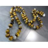 Recently re-strung Tigers eye bead and flower spacer necklace approx 26" long with ball strong
