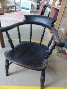 Oak smokers chair with scrolled arms