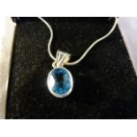Silver Oval approx 11mm x 8.9mm wide pale Blue set pendant and hung from a 16" Fine Brazilian link