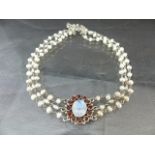 Silver Choker Necklace, central oval Moonstone approx: 10mm x 12mm, surrounded by 12 approx: 3.