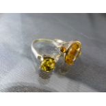 Two Amber set silver rings - approx weight - 5g