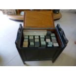 Piano stool containing 29 Pianola scrolls in boxs