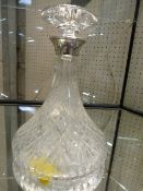 Moulded glass decanter with hallmark silver collar. Marks for Birmingham F G Flavell Ltd 1988.