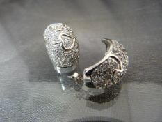 Pair of silver and CZ heavy-set half hoop-style earrings