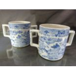 Pair of unmarked blue and white Willow Pattern loving cups with twin handles