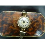 Medana 9ct gold ladies wristwatch on expanding 9ct on silver strap (winds and ticks) A/F