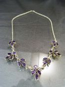 Silver and Amethyst necklace set with 21 Marquise and 3 round cut stones