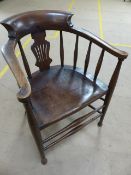 Late 19th Century Elm and Beech smokers bow elbow chair. Shaped and pierced splat to back with