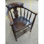 Late 19th Century Elm and Beech smokers bow elbow chair. Shaped and pierced splat to back with