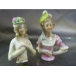 Two Tea Cosy embellishments of ladies with hats (Porcelain c.1920's)
