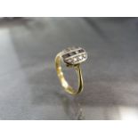 18ct Gold ring set with a row of Sapphires flanked either side with Diamonds