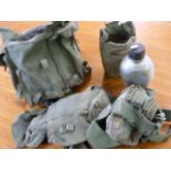 Green military kit bag with contents