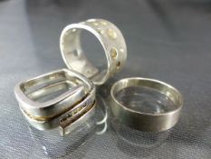 Three silver rings including one by Fossil set with five small square CZ stones