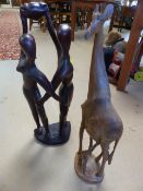 Handcarved figure group of dancing couple in hardwood and a figure group of a mother Giraffe and her