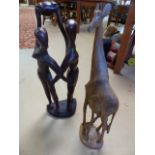 Handcarved figure group of dancing couple in hardwood and a figure group of a mother Giraffe and her