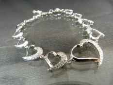 Silver and CZ bracelet in the form of a row of hearts