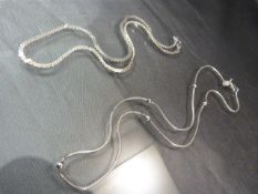 2 x Silver chains (1) approx: 14” Serpentine. (2) approx: 17” Brazilian link chain interspersed with