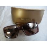 Pair of Gucci sunglasses with prescription lenses