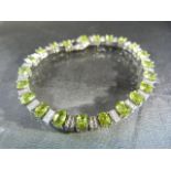 Silver CZ and Peridot line bracelet