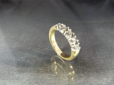 A yellow gold five stone diamond half-eternity ring