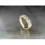 A yellow gold five stone diamond half-eternity ring