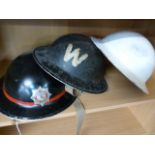 Devon County Fire and Rescue Service metal helmet and two other warden helmets - 2 shelves