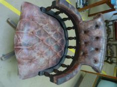 A Red BUTTONED LEATHER SWIVEL CAPTAINS CHAIR, on castors