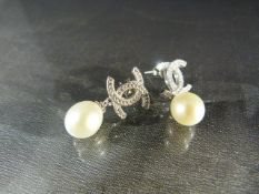 Pair of silver and fresh water CZ and pearl drop designer-style earrings