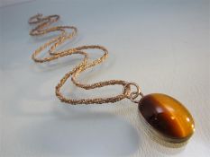 Vintage silver Tiger's eye pendant of an approx 25mm x 19mm across oval cabochon stone with the