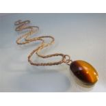 Vintage silver Tiger's eye pendant of an approx 25mm x 19mm across oval cabochon stone with the