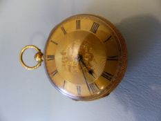 18ct Gold cased pocket watch. Winds and ticks. Roman Numeral Chapter ring. Back Decorated with