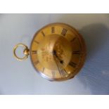 18ct Gold cased pocket watch. Winds and ticks. Roman Numeral Chapter ring. Back Decorated with