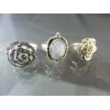 Three silver rings including 2 marcasite rings and 1 moonstone set ring. Total approx weight - 12.