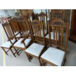 Set of eight oak dining room chairs in the Arts and Crafts style (inc two carvers)