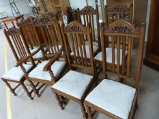 Set of eight oak dining room chairs in the Arts and Crafts style (inc two carvers)