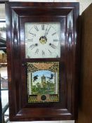 An Ogee American 30hr wall clock by 'Jerome & Co' with winder and pendulum in office.