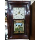 An Ogee American 30hr wall clock by 'Jerome & Co' with winder and pendulum in office.