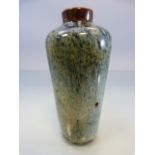 Chinese 'Flambe' Vase of bottle form. Mottle blue ground with brown top.
