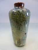 Chinese 'Flambe' Vase of bottle form. Mottle blue ground with brown top.