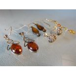 Bag of earrings to include Amber set celtic drops, silver Marcasite flowers and others