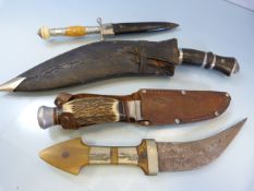 Four hand held knives - to include two Kuhkri type knives, one other with unusual handle of orange