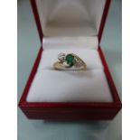 9ct ladies twisted gold ring set with central Emerald stone
