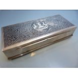 A large Thai Nielloware silver cigarette box, of rectangular form, typically decorated with the