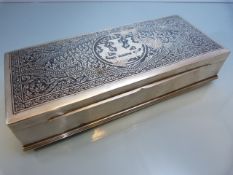 A large Thai Nielloware silver cigarette box, of rectangular form, typically decorated with the