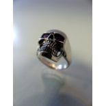 Silver skull ring with ruby eyes