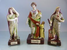 Three early 19th century Staffordshire Prattware Figures of Faith (with damage to arm), Hope and