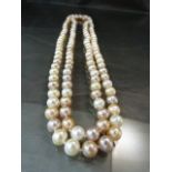 Approx 110cm length necklace of pearls in shades of pinks
