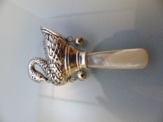 Silver baby's rattle in the shape of a swan with mother of pearl handle