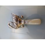 Silver baby's rattle in the shape of a swan with mother of pearl handle